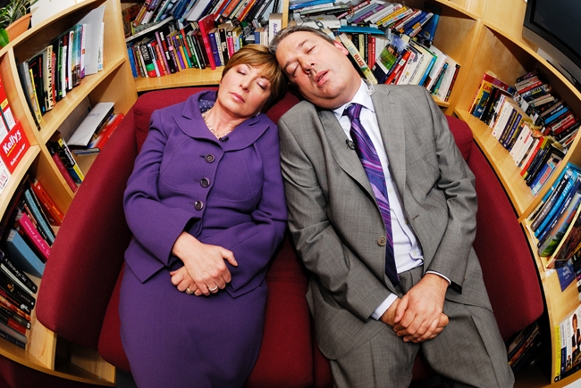 Calendar News Presenters fake taking a nap as part of their Sarahphotogirl Feature at Leeds Studios.