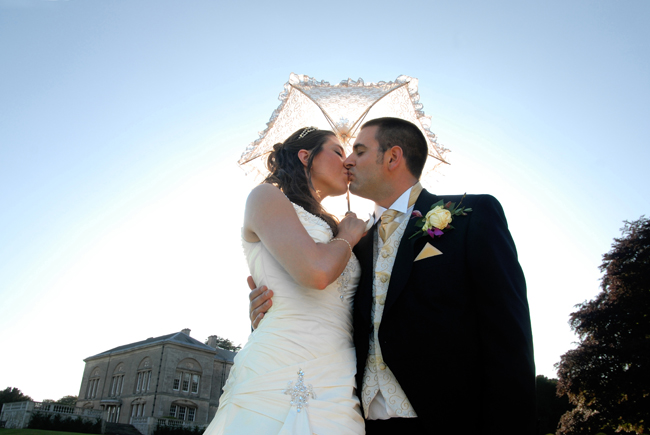 The Bride and Groom under a parasol 